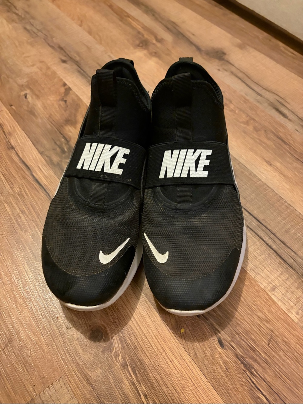 Nike Black Slip-On Sneakers with White Accents
